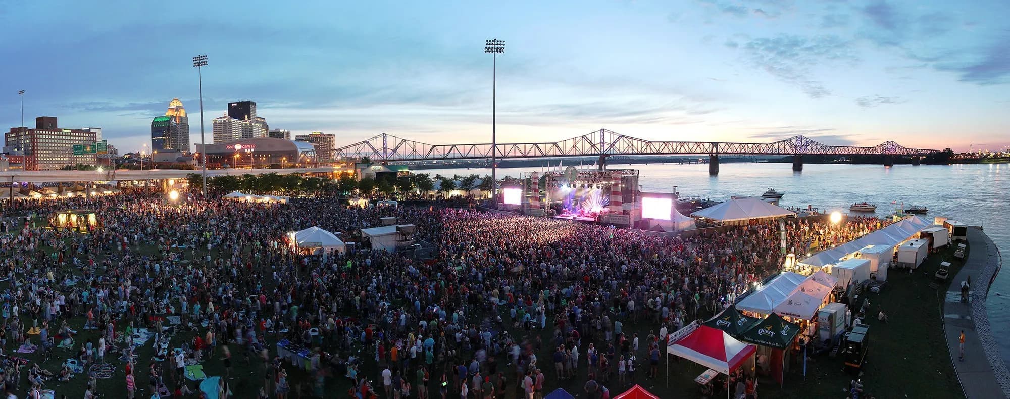 The Forecastle Festival mast stage - fans and festival sponsors along the Ohio River riverfront in downtown Louisville, KY