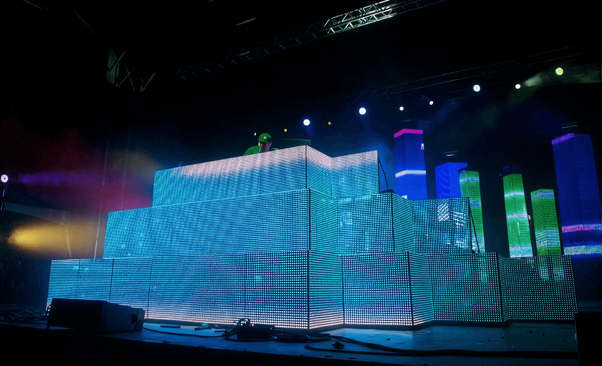 Glowing LED cube stage installation lighting up a dark venue