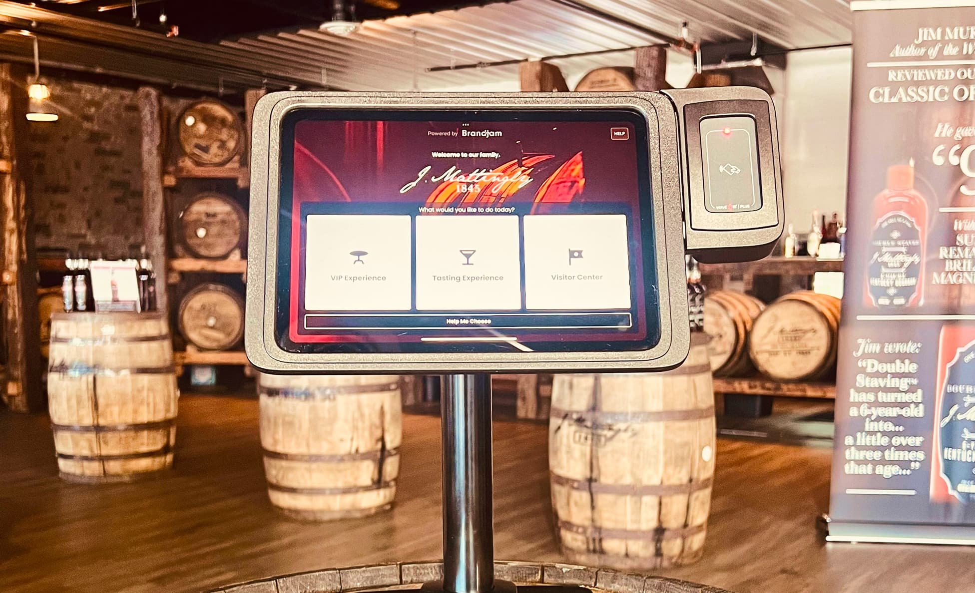 Self-service touchscreen kiosk offering VIP, tasting, and visitor center options