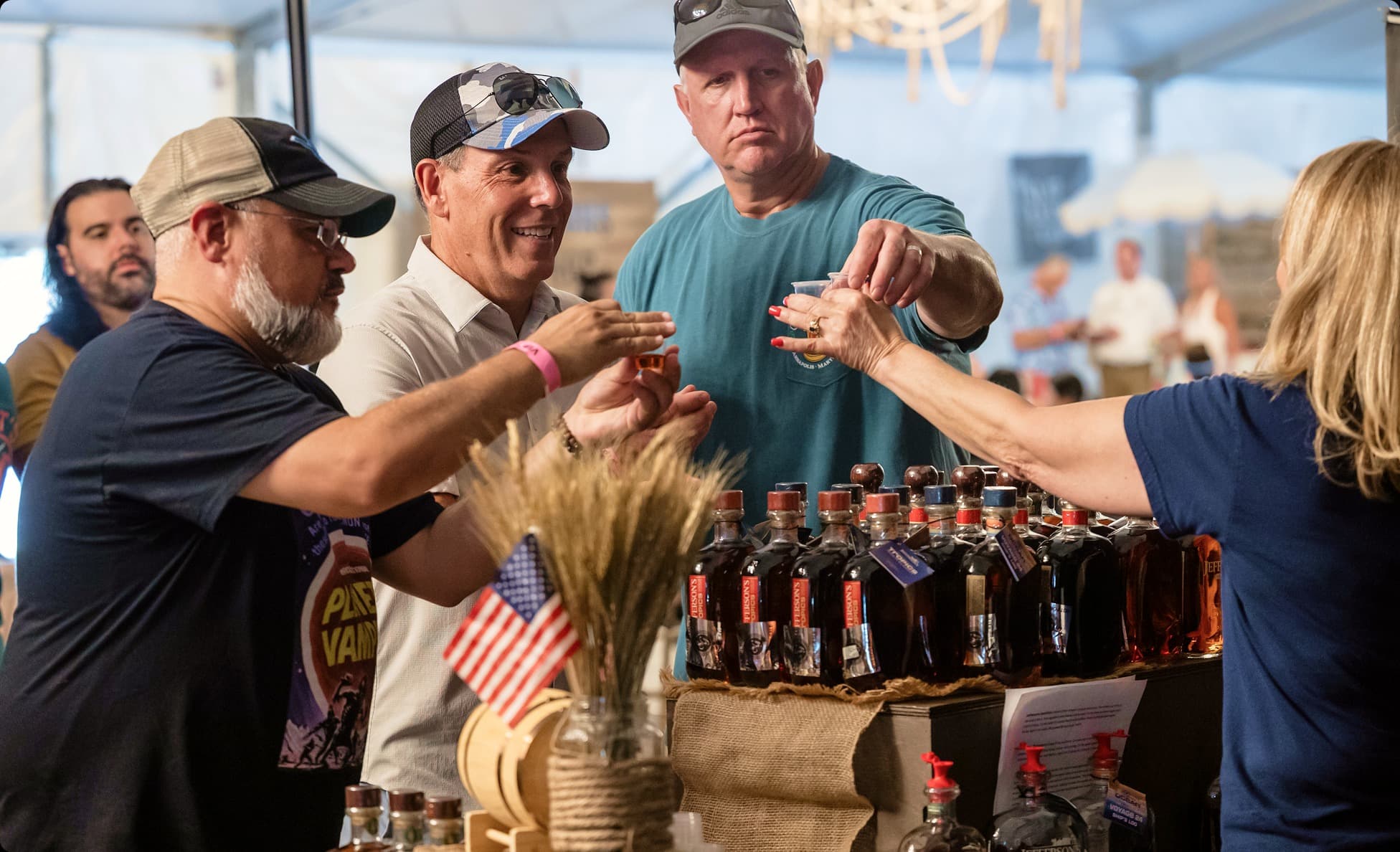Guests sampling small-batch bourbon at a tasting bar