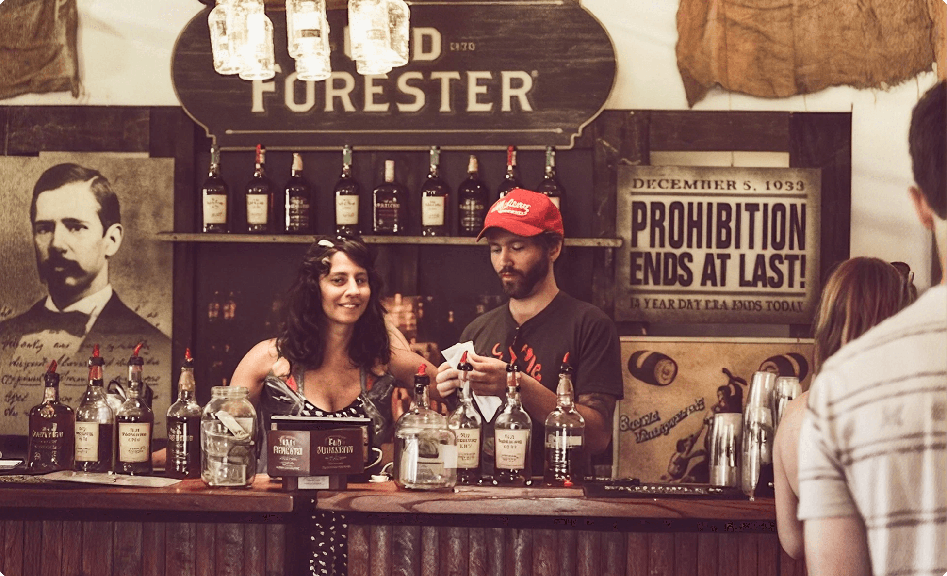 Prohibition-era themed bar with vintage bottles and bartenders