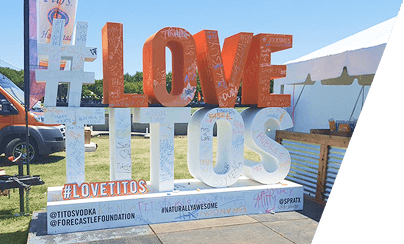 I Love Tito's sponsor activation booth with branded signage
